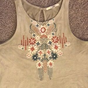 Suede, embroidered top with peephole back